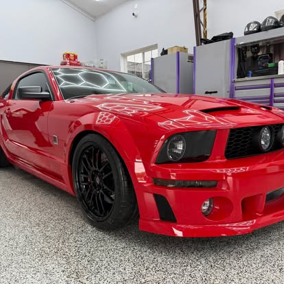 Red Mustang detailed inside the J&J Express Services shop